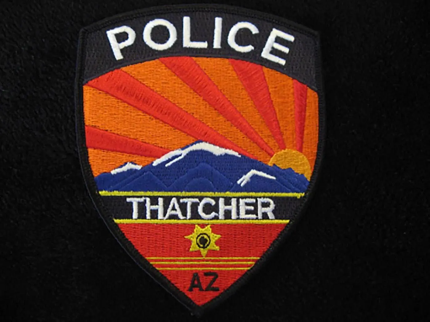 A patch of the police department that is in thatcher.